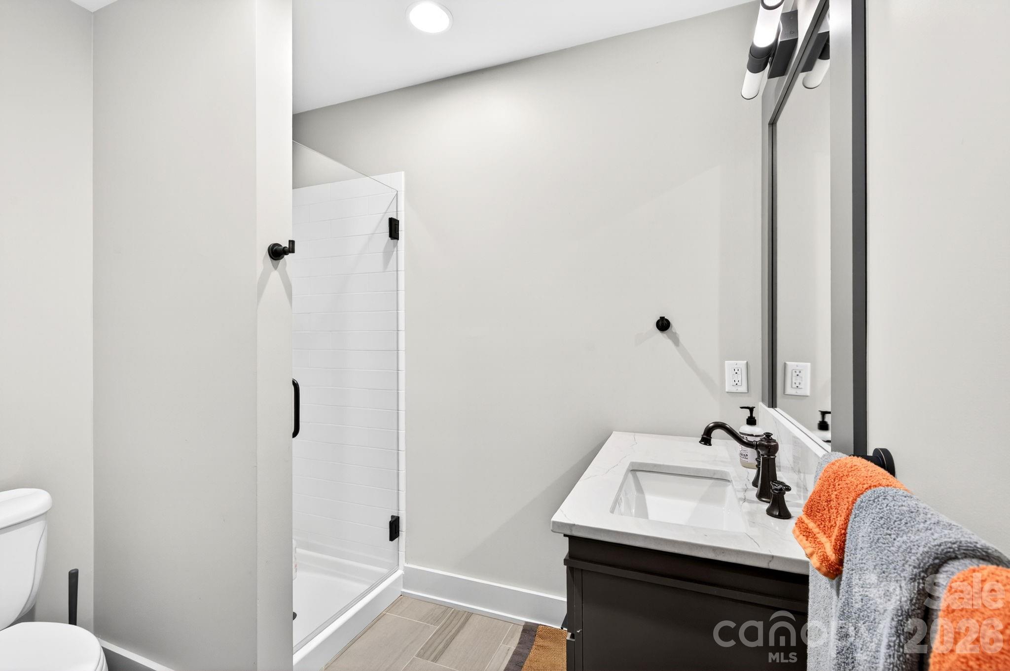 235 Bull Creek Road Asheville, NC 28805 - Photo 25 of 47 a bathroom with a sink and a mirror