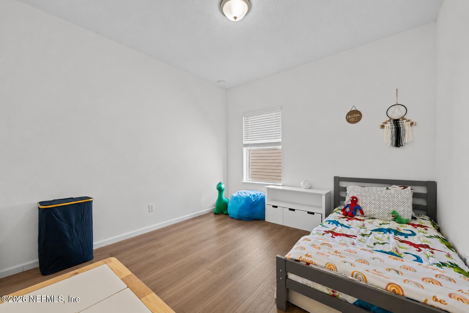 92 Patina Place St. Augustine, FL 32092 - Photo 21 of 26 a bedroom with a bed and a window