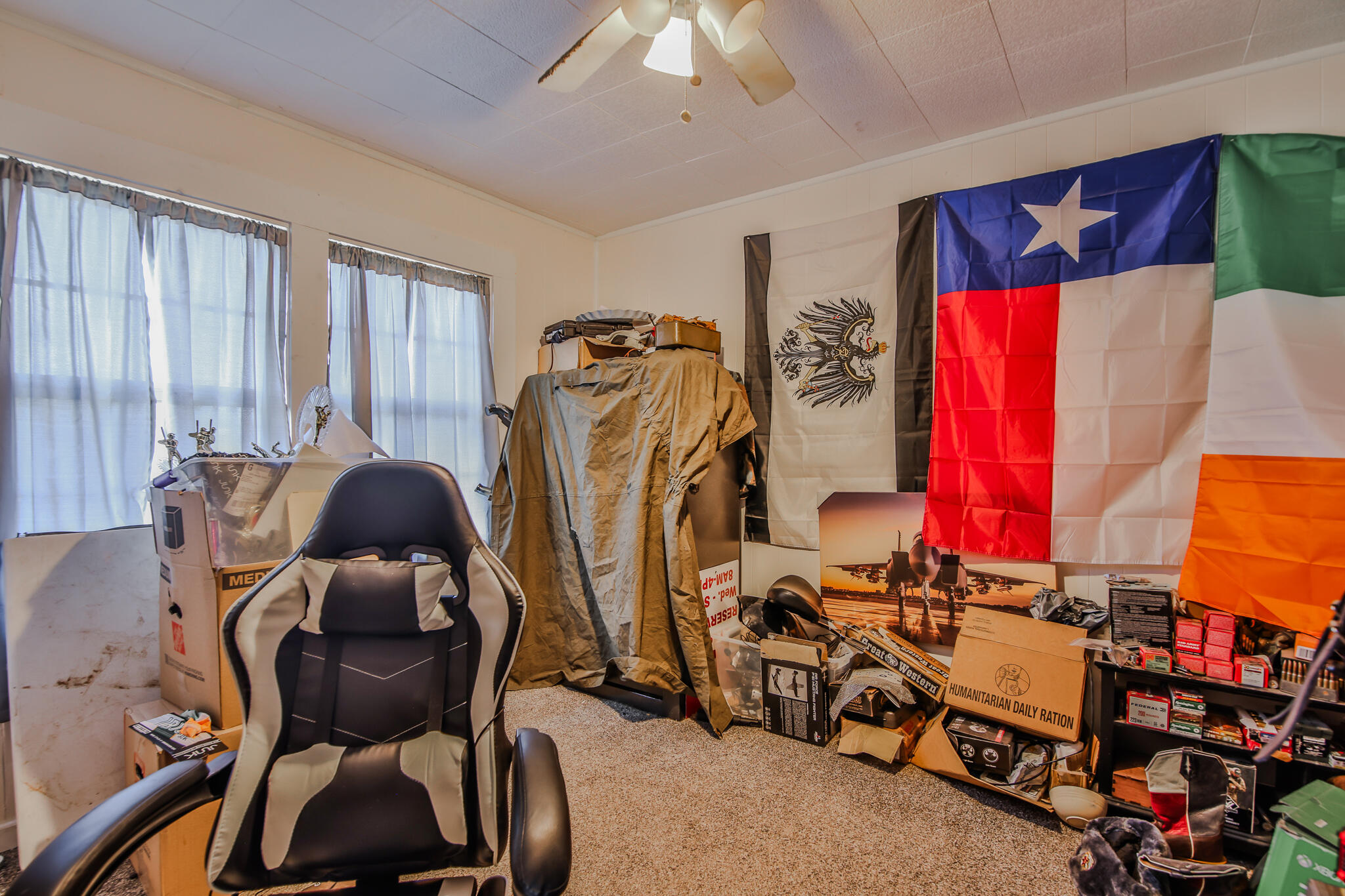 805 South 4th Street Slaton, TX 79364 - Photo 12 of 28 a room with gym equipment and a mirror