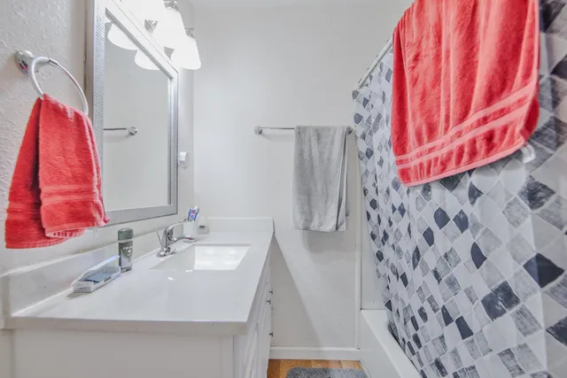 a bathroom with a sink and a mirror