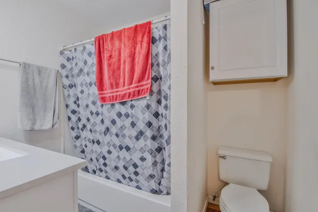 a bathroom with a toilet and a sink