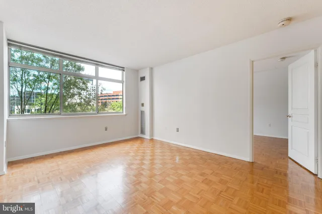 a view of an empty room with a window