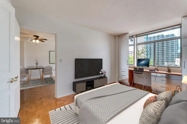 a bedroom with a bed and a television in it