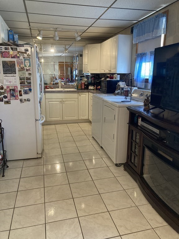 274 Plantation Street Worcester, MA 01604 - Photo 12 of 27 a kitchen with stainless steel appliances granite countertop a sink a stove a microwave and cabinets