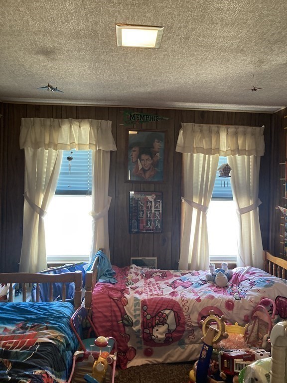 274 Plantation Street Worcester, MA 01604 - Photo 15 of 27 a bedroom with a bed and a window