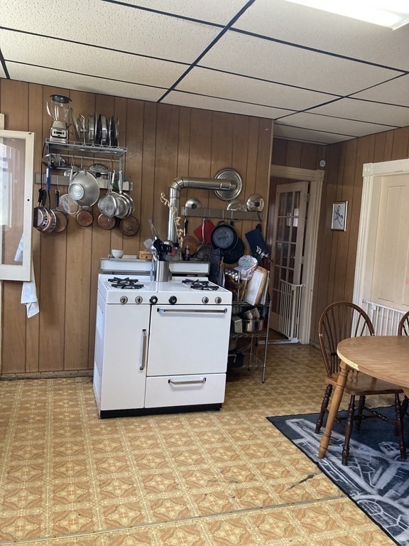 274 Plantation Street Worcester, MA 01604 - Photo 18 of 27 a utility room with stainless steel appliances granite countertop a stove and a refrigerator