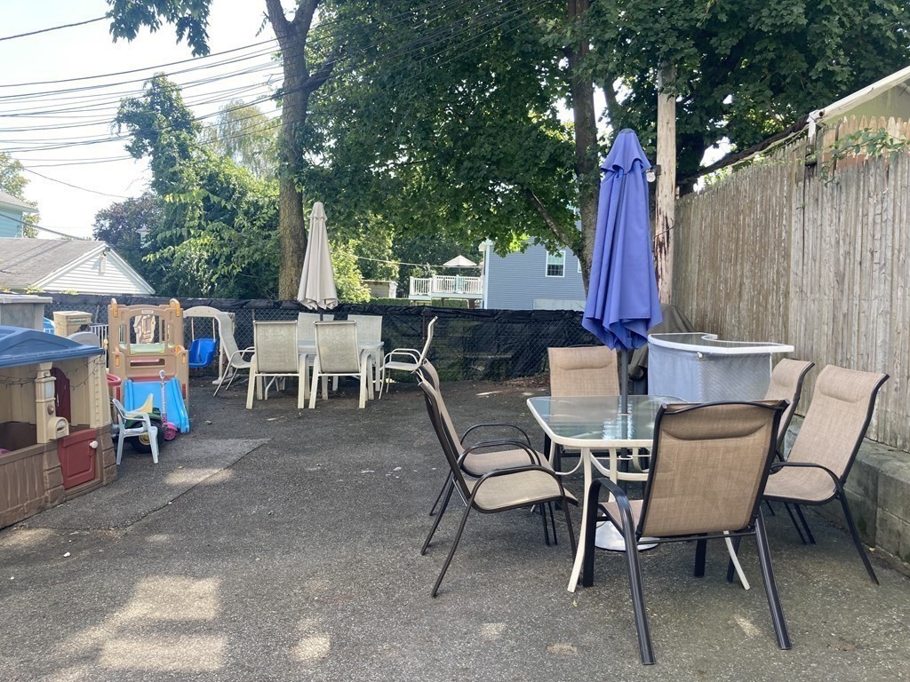 274 Plantation Street Worcester, MA 01604 - Photo 26 of 27 a view of a chairs and table in patio