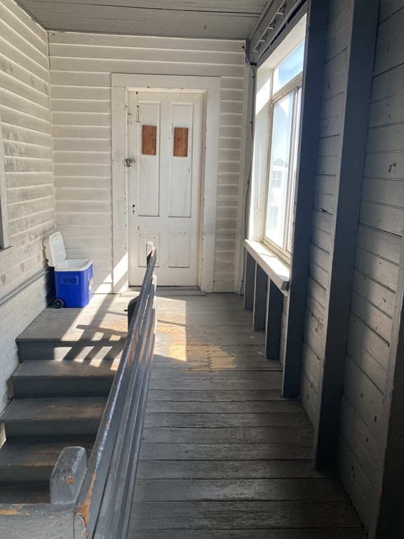 274 Plantation Street Worcester, MA 01604 - Photo 7 of 27 a view of a living room with furniture and wooden floor