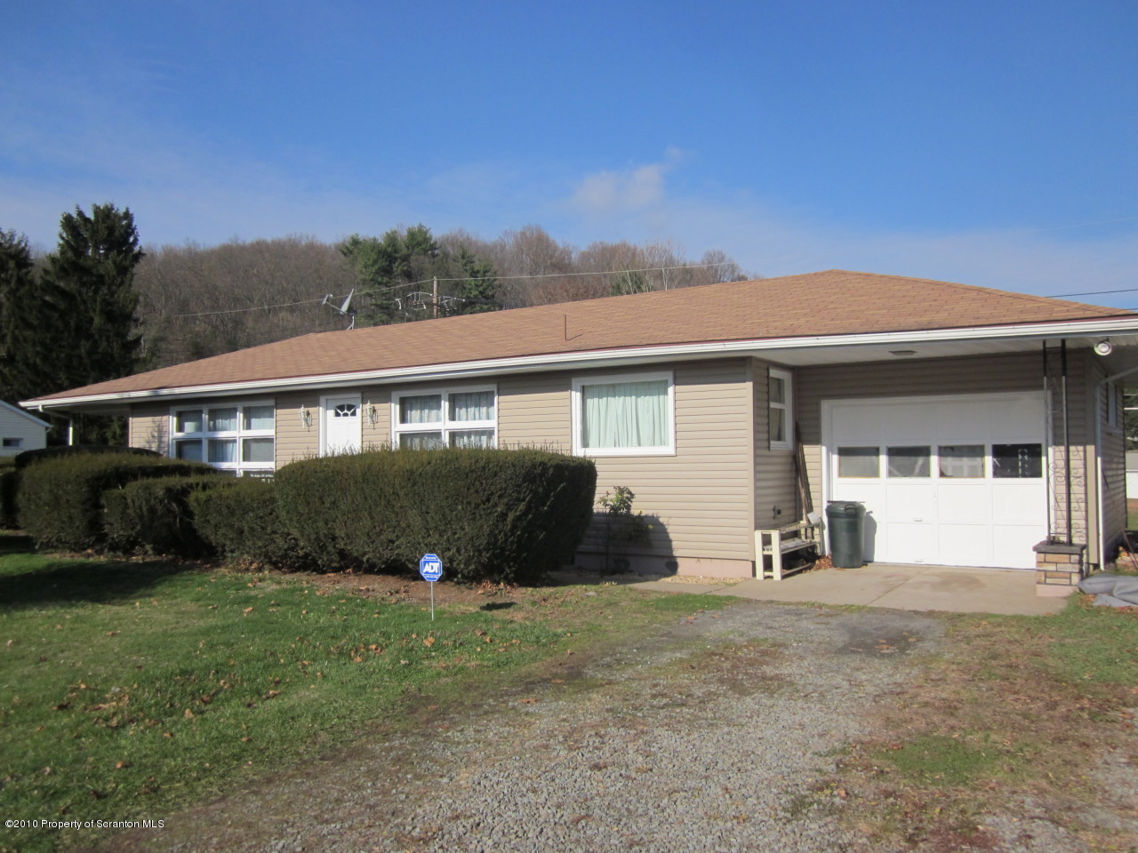 512 State Rte 92 South Tunkhannock, PA 18657 - Photo 1 of 8 a front view of a house with a garden