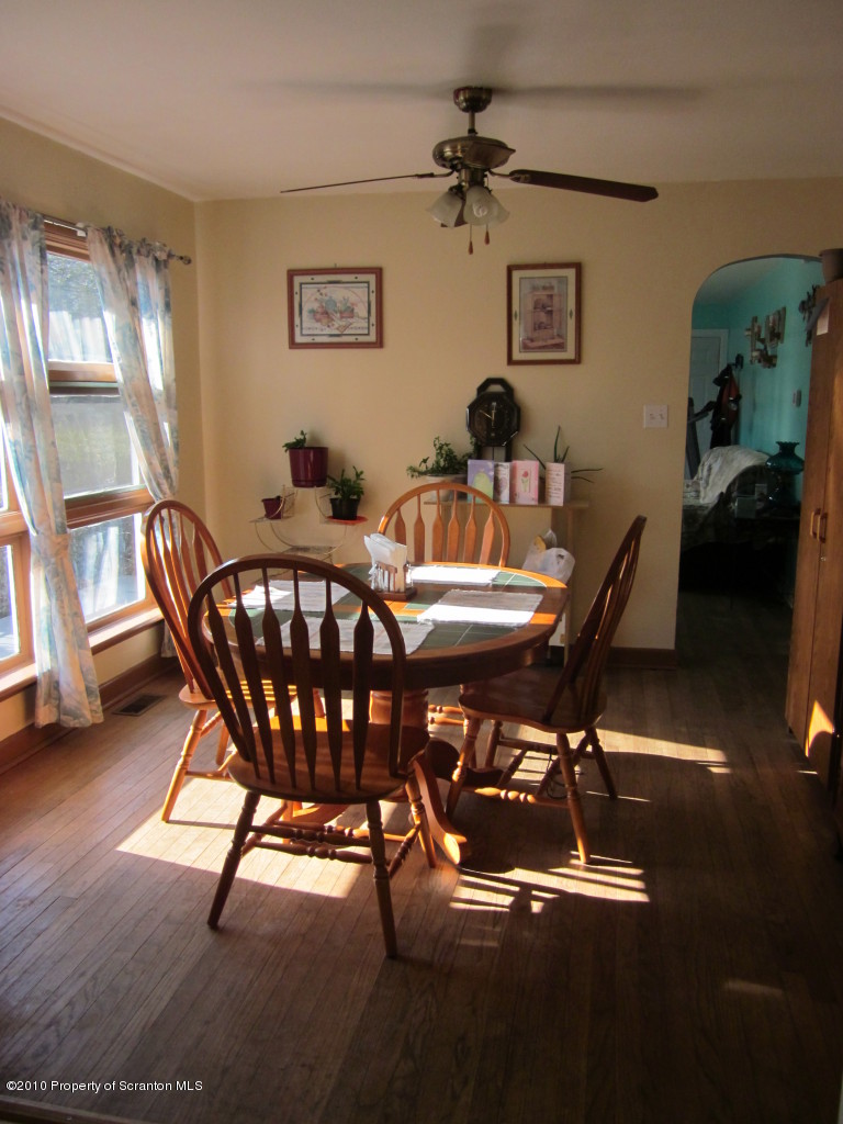 512 State Rte 92 South Tunkhannock, PA 18657 - Photo 3 of 8 a view of a dining room with furniture and a chandelier
