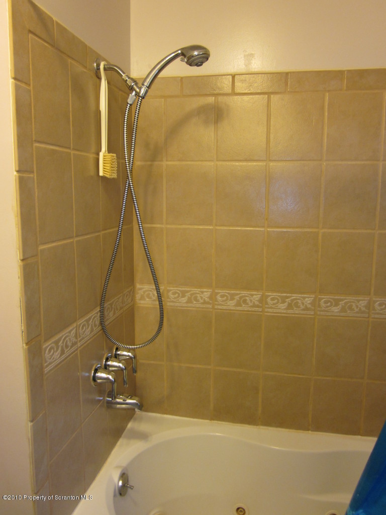 512 State Rte 92 South Tunkhannock, PA 18657 - Photo 5 of 8 a bathroom with a shower and a sink