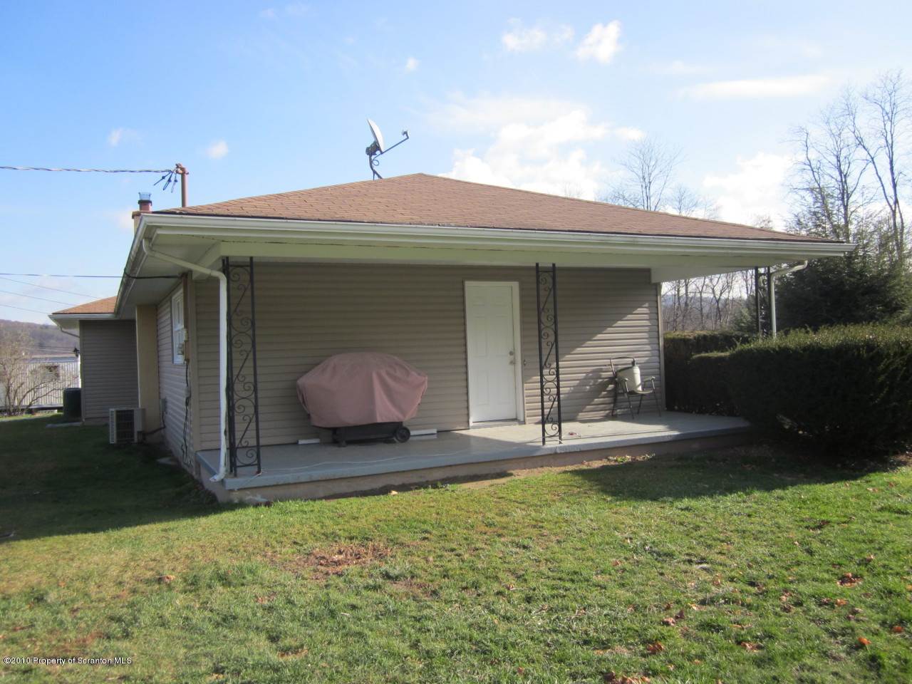 512 State Rte 92 South Tunkhannock, PA 18657 - Photo 7 of 8 a front view of a house with garden