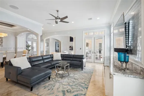 a living room with furniture or couch and a chandelier
