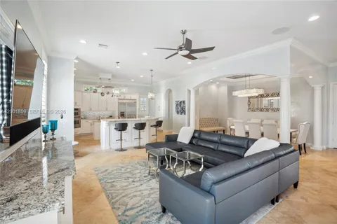 a living room with furniture wooden floor and a flat screen tv