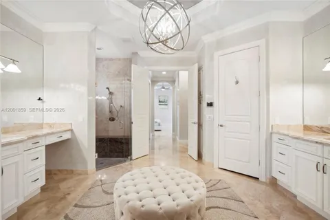 a spacious bathroom with a shower sink and a mirror