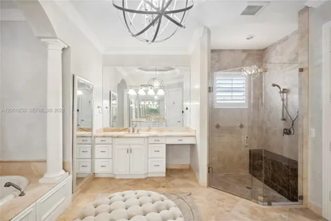 a bathroom with a tub sink shower and mirror