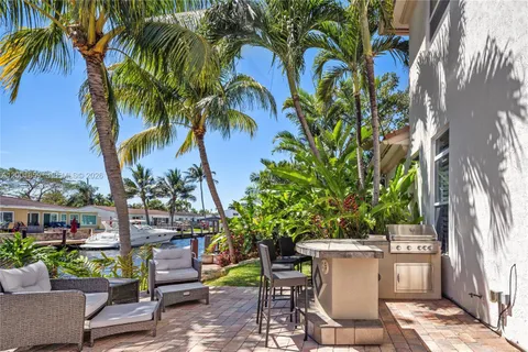 a view of a chairs and table in a patio