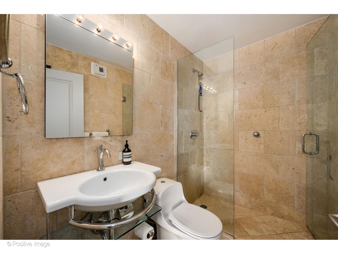 1310 North Ritchie Court, Unit 26C Chicago, IL 60610 - Photo 20 of 34 a bathroom with a sink toilet a mirror and shower