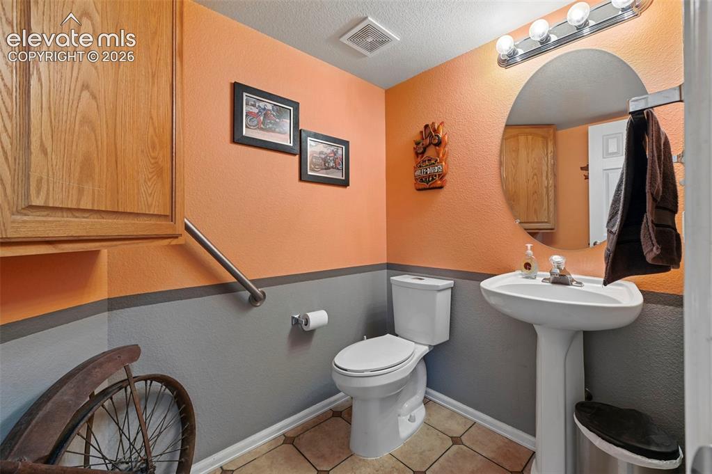 12571 Scamper Road Peyton, CO 80831 - Photo 15 of 49 Main level bathroom