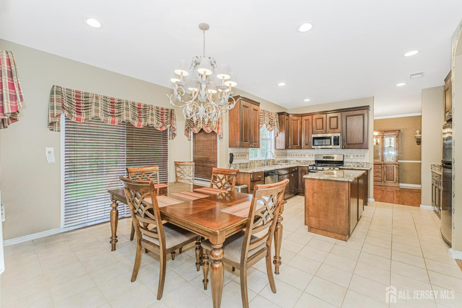 19 Helene Street Old Bridge, NJ 08857 - Photo 18 of 46 a view of a dining room with furniture and chandelier