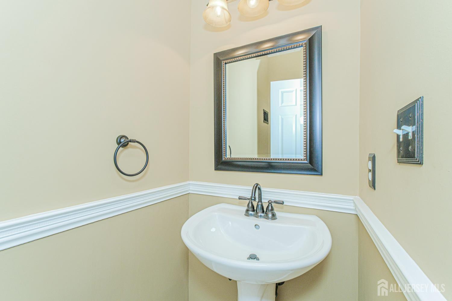 19 Helene Street Old Bridge, NJ 08857 - Photo 21 of 46 a bathroom with a sink and a mirror