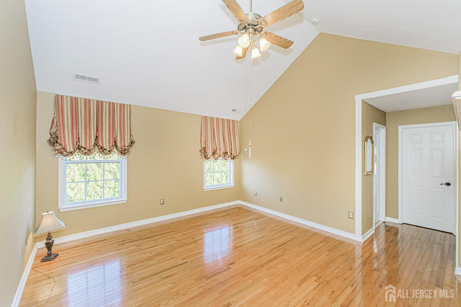 19 Helene Street Old Bridge, NJ 08857 - Photo 26 of 46 an empty room with wooden floor fan and windows