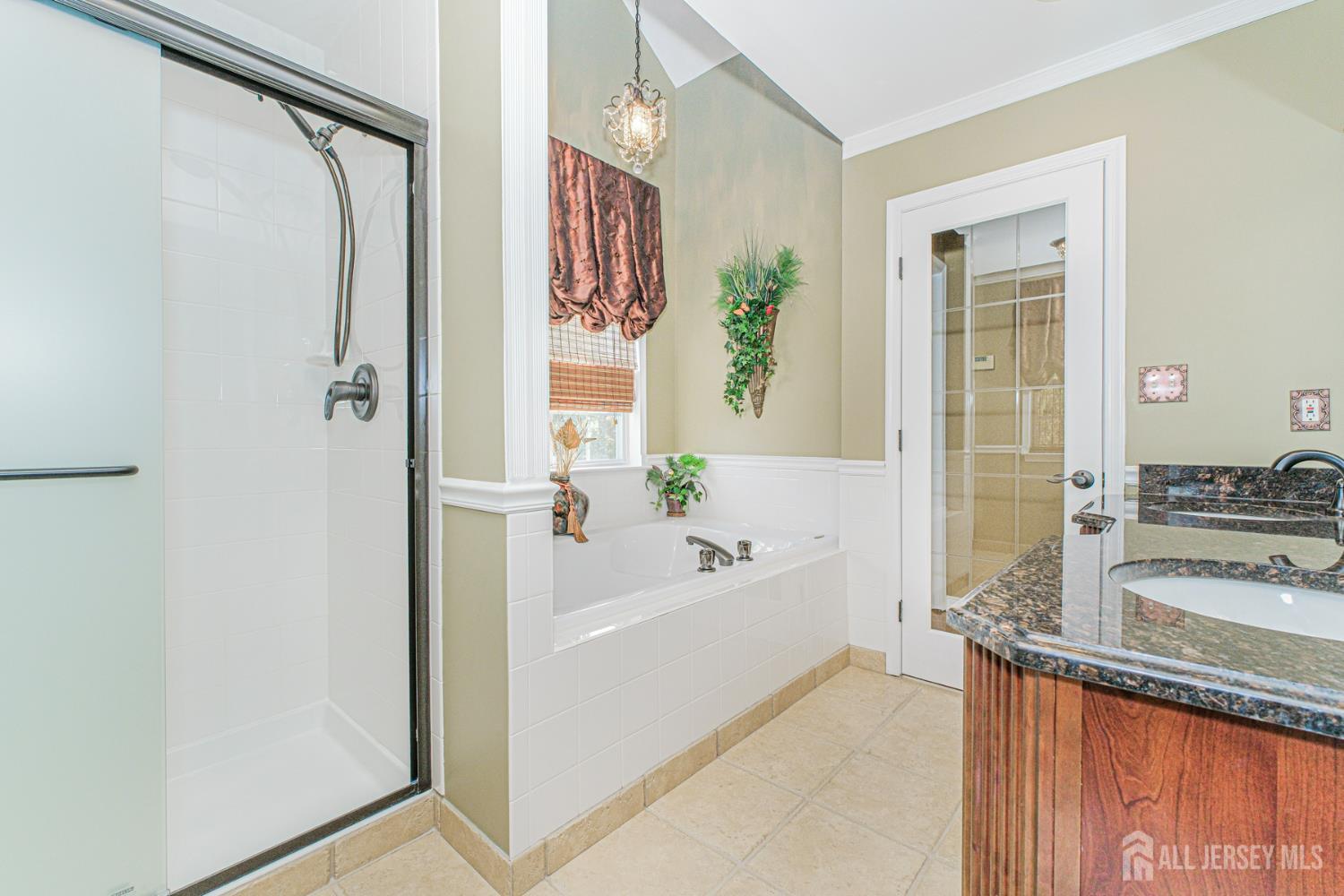 19 Helene Street Old Bridge, NJ 08857 - Photo 28 of 46 a bathroom with a granite countertop sink mirror bathtub and shower