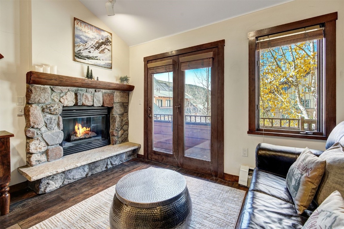 91 River Run Road, Unit 8137 Keystone, CO 80435 - Photo 11 of 37 a living room with furniture a large window and a fireplace