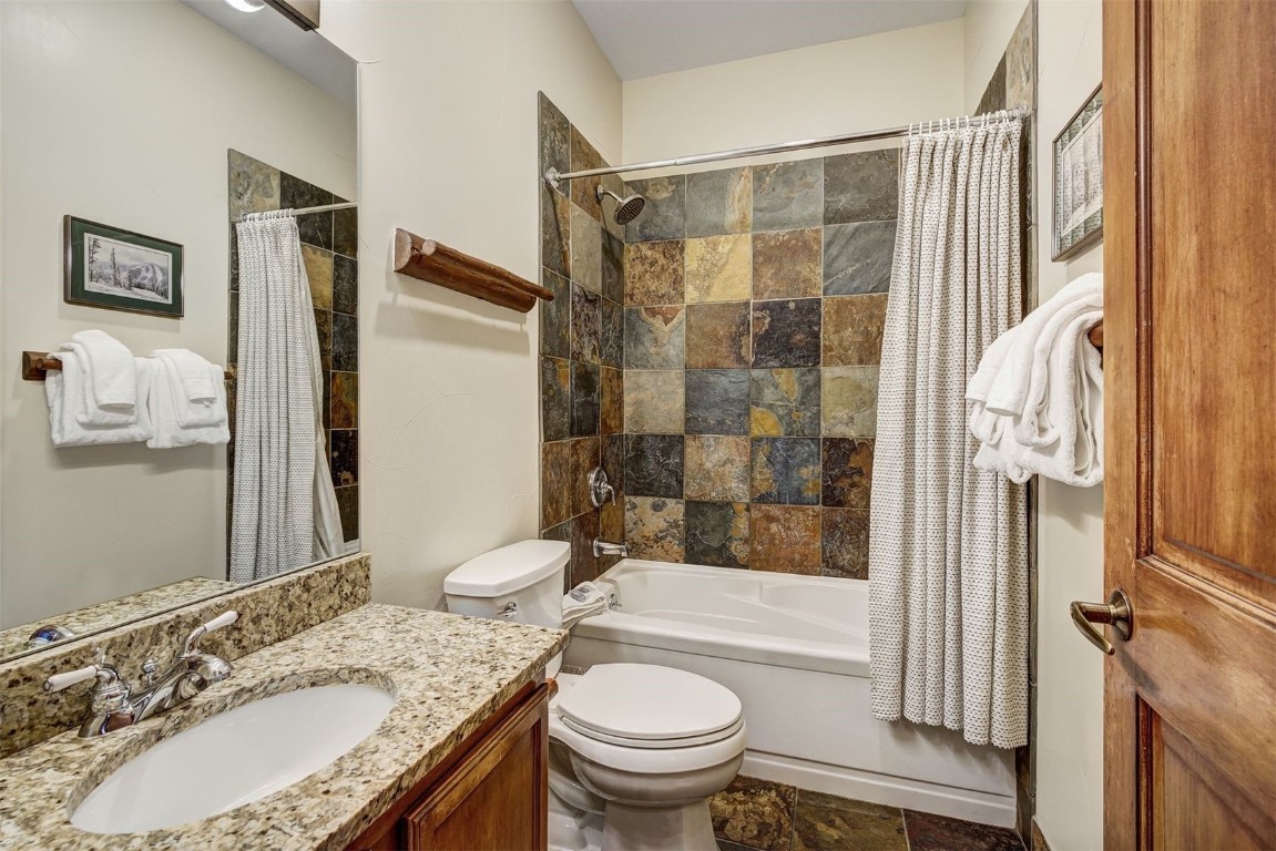 91 River Run Road, Unit 8137 Keystone, CO 80435 - Photo 12 of 37 a bathroom with a granite countertop sink toilet and shower