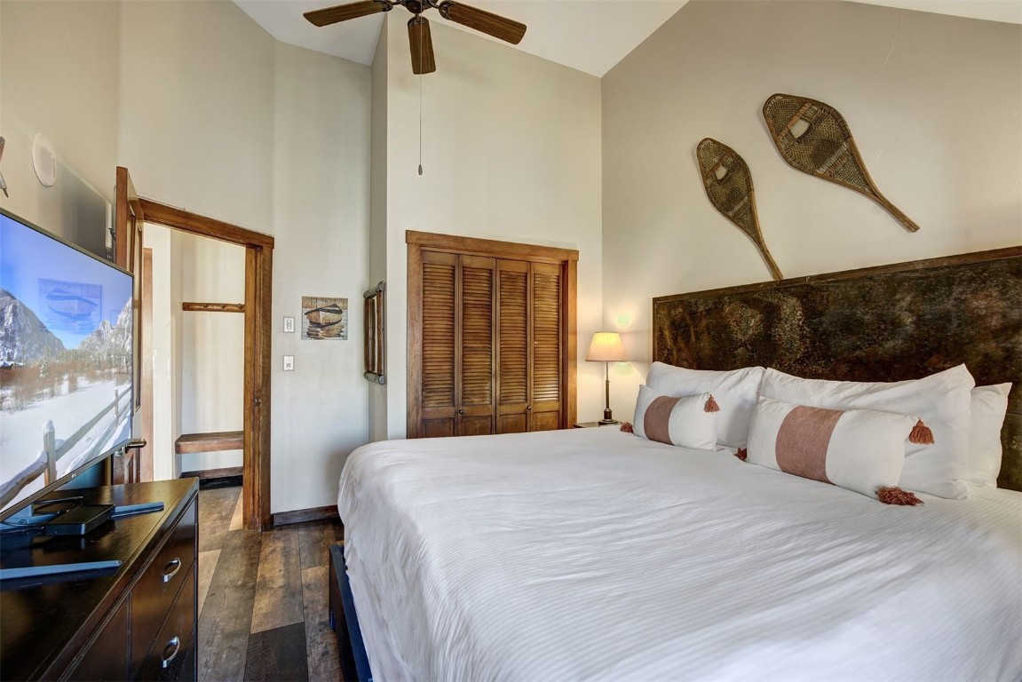 91 River Run Road, Unit 8137 Keystone, CO 80435 - Photo 13 of 37 a bedroom with a bed and a flat tv screen on the dresser