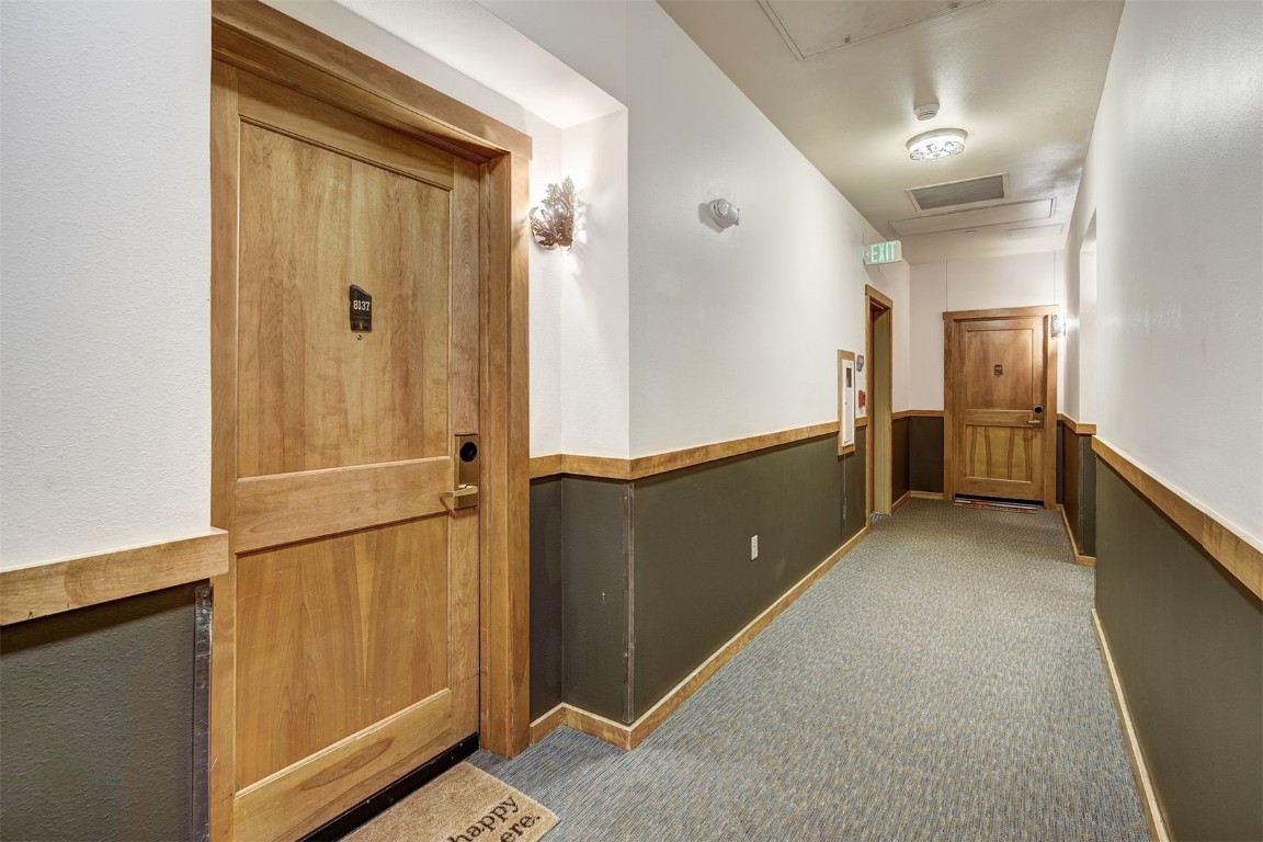 91 River Run Road, Unit 8137 Keystone, CO 80435 - Photo 20 of 37 wooden floor and cabinet in an empty room