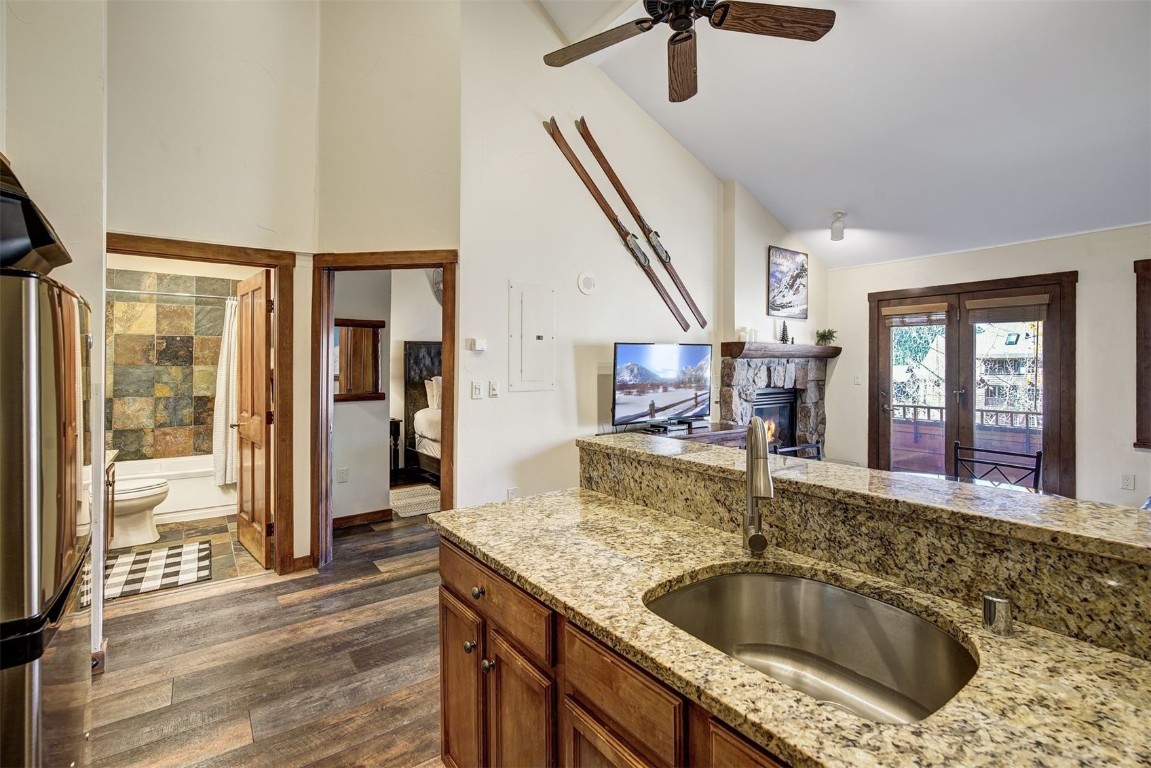 91 River Run Road, Unit 8137 Keystone, CO 80435 - Photo 2 of 37 a kitchen with a sink a counter space and a view of living room