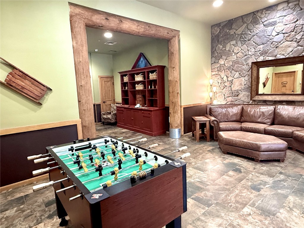 91 River Run Road, Unit 8137 Keystone, CO 80435 - Photo 26 of 37 a living room with furniture and a rug