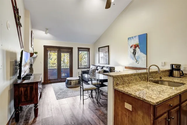 a living room with granite countertop furniture a dining table and chairs