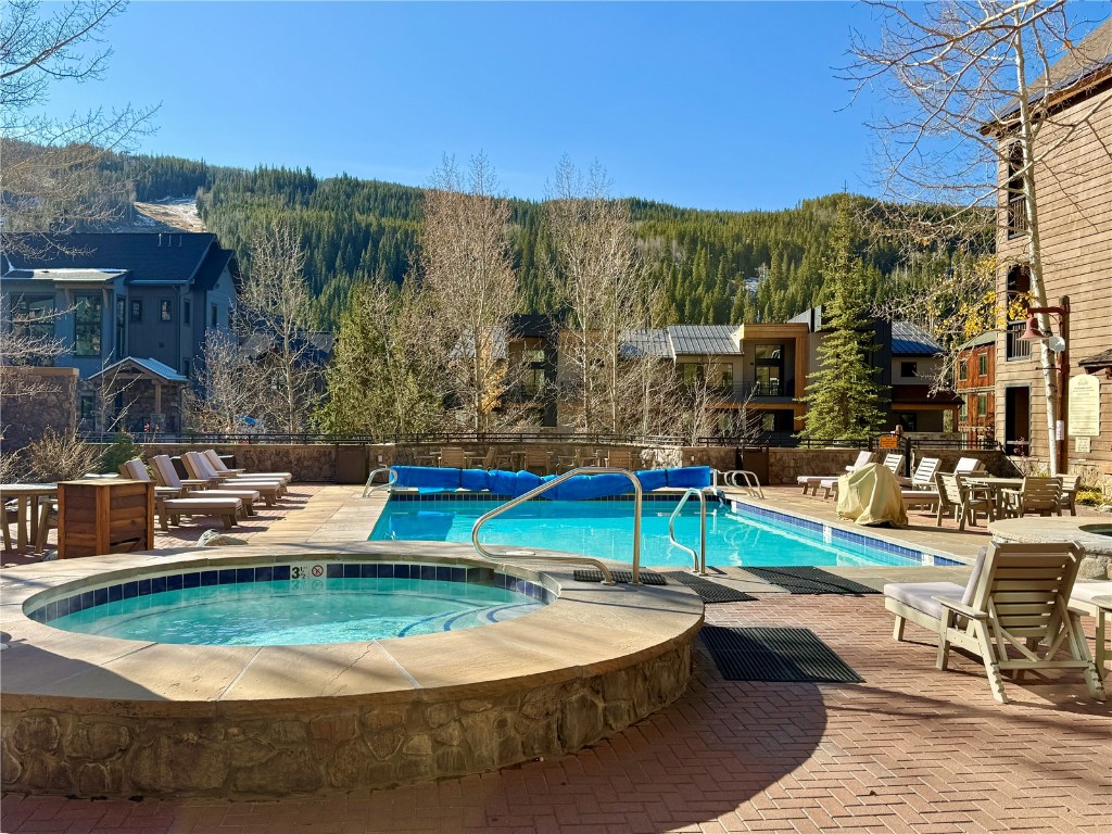 91 River Run Road, Unit 8137 Keystone, CO 80435 - Photo 32 of 37 a view of a swimming pool with a patio