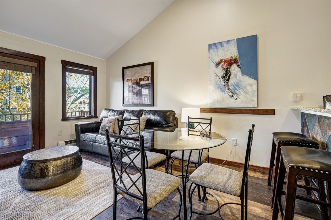 91 River Run Road, Unit 8137 Keystone, CO 80435 - Photo 4 of 37 a view of a dining room with furniture and a large window