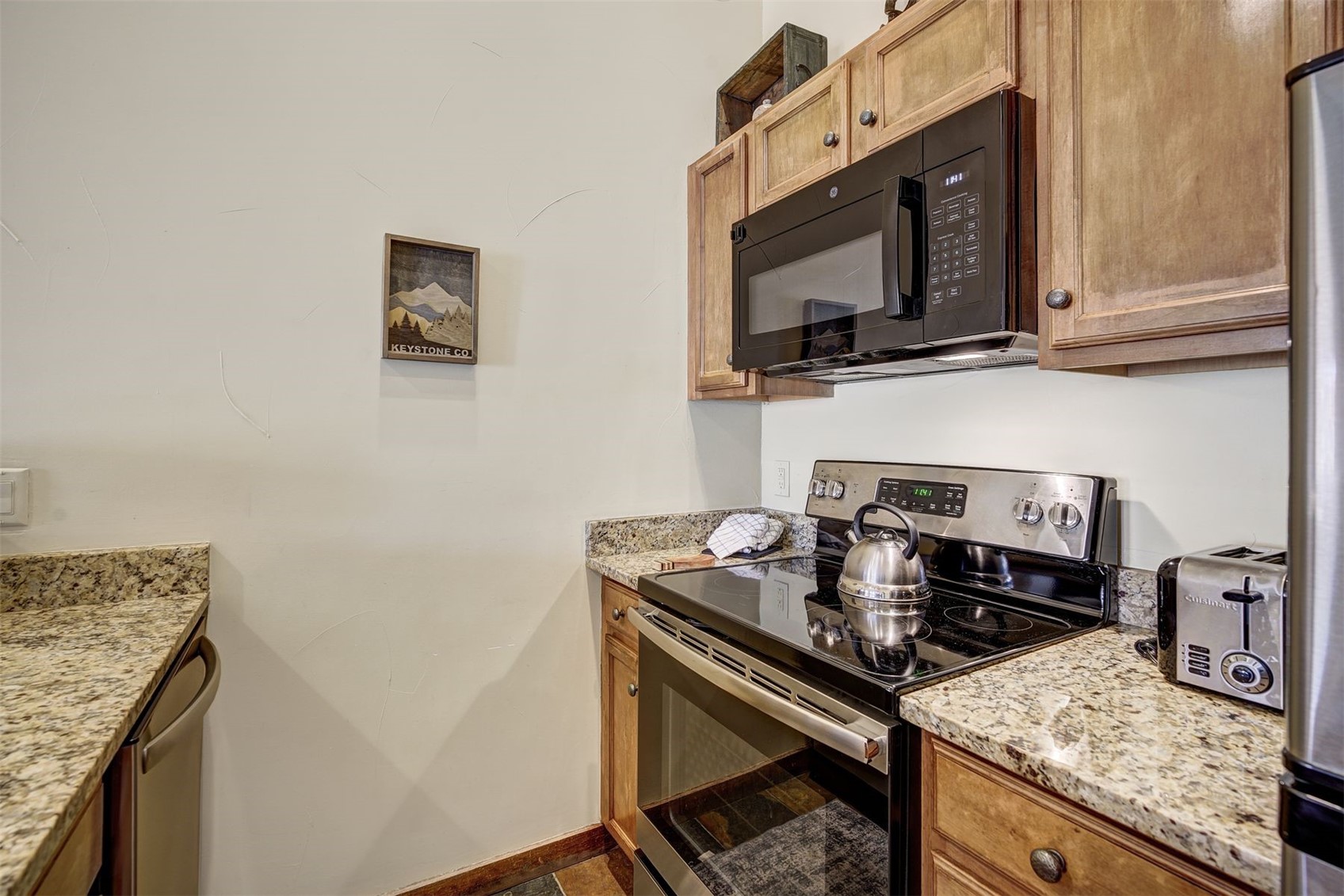91 River Run Road, Unit 8137 Keystone, CO 80435 - Photo 7 of 37 a kitchen with granite countertop a stove and a sink