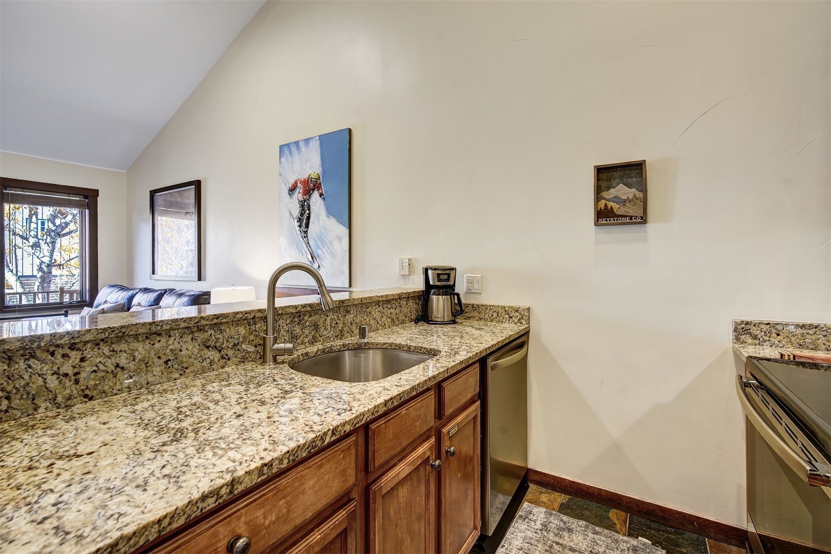 91 River Run Road, Unit 8137 Keystone, CO 80435 - Photo 8 of 37 a kitchen with sink and mirror