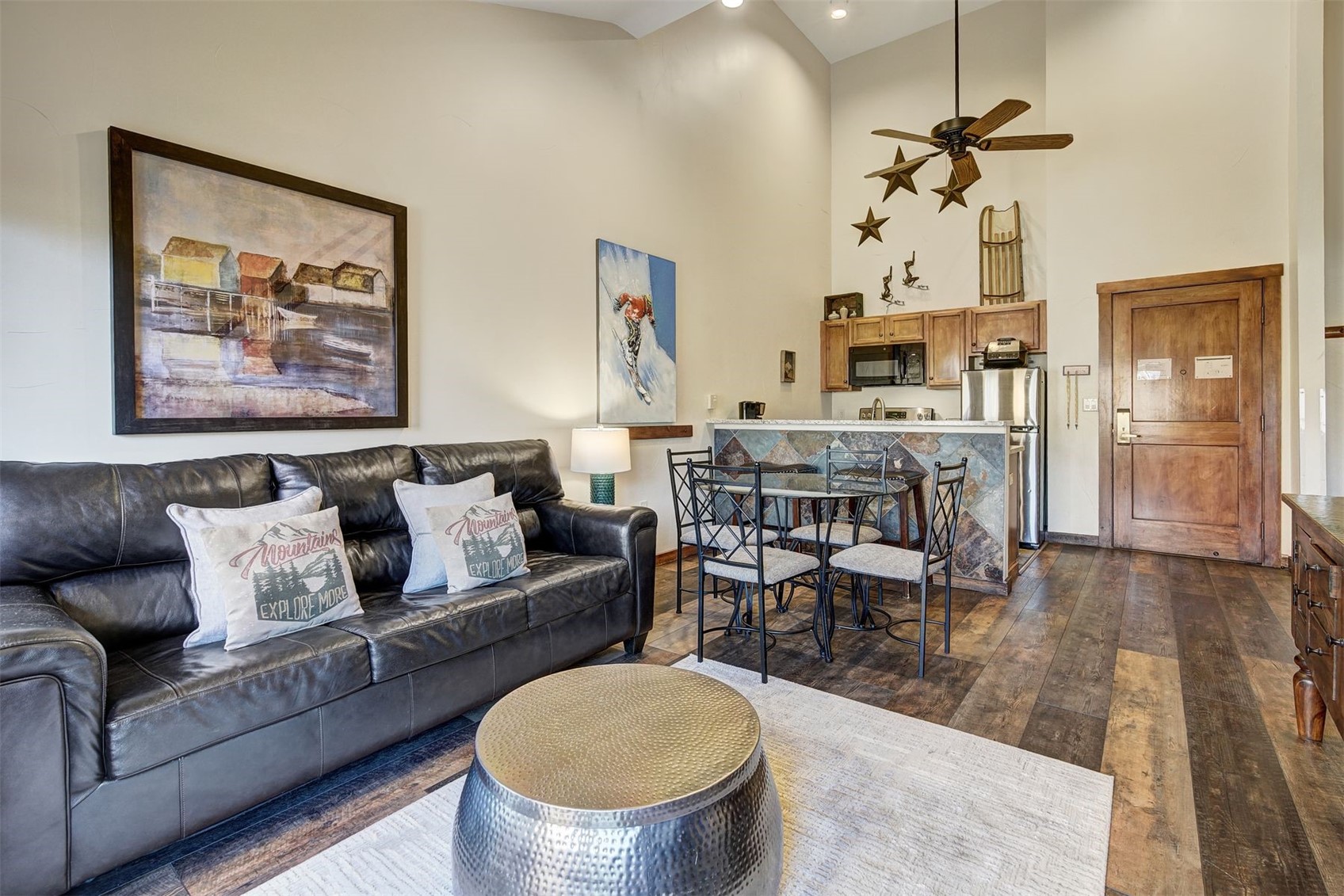 91 River Run Road, Unit 8137 Keystone, CO 80435 - Photo 10 of 37 a living room with furniture a chandelier and a dining table