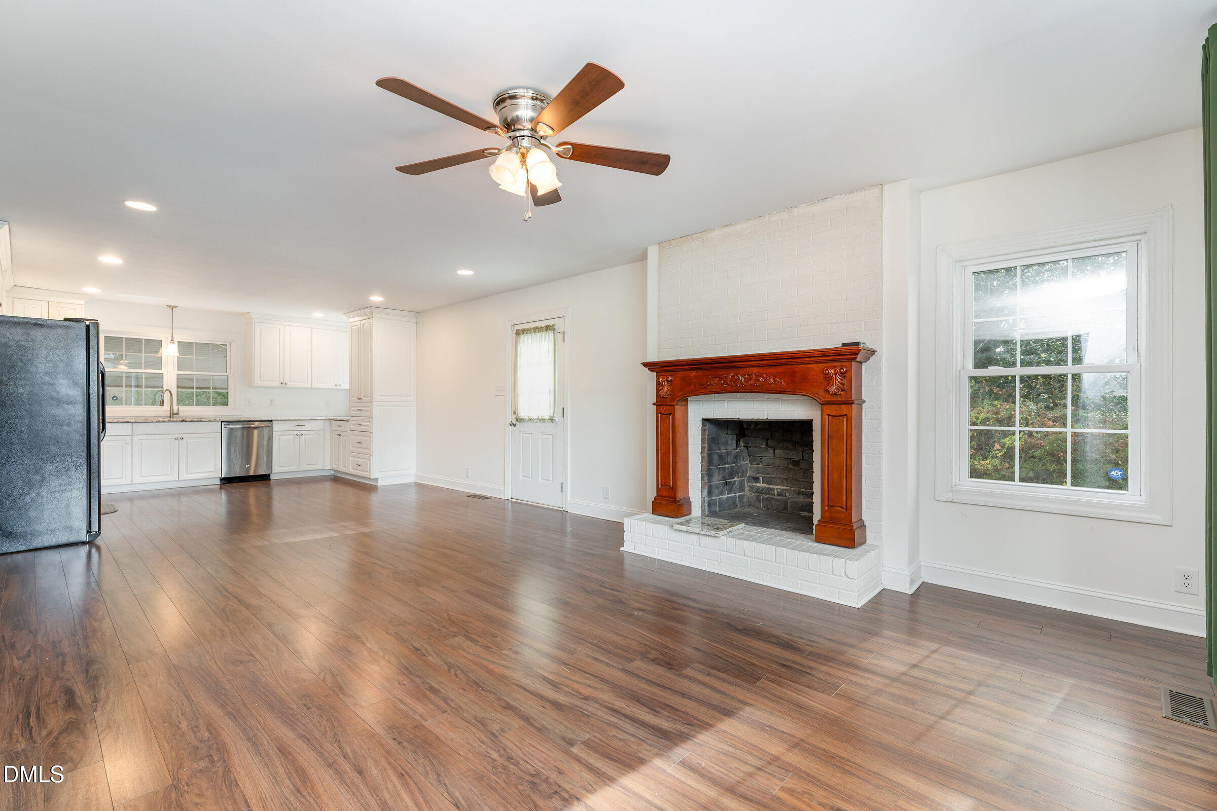 4159 Princeton Kenly Road Kenly, NC 27542 - Photo 10 of 37 a view of an empty room with a fireplace and a window
