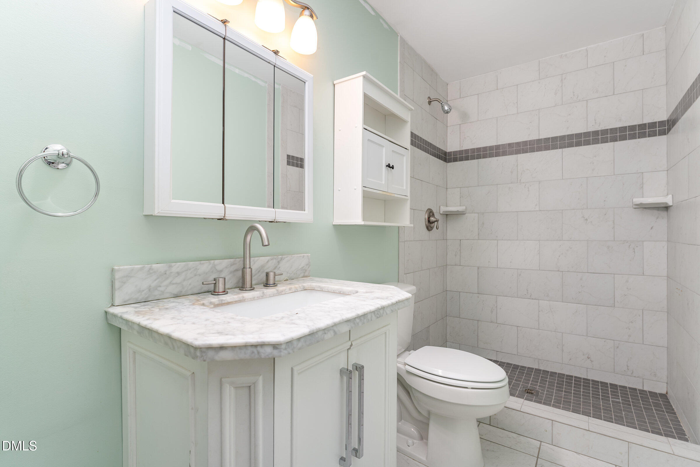 4159 Princeton Kenly Road Kenly, NC 27542 - Photo 24 of 37 a bathroom with a sink a toilet and a mirror