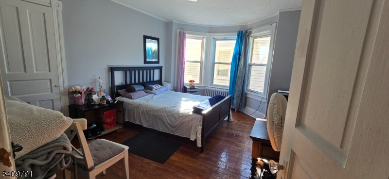 597 Belvidere Road, Unit 2 Phillipsburg, NJ 08865 - Photo 11 of 15 a bed room with a bed and a window