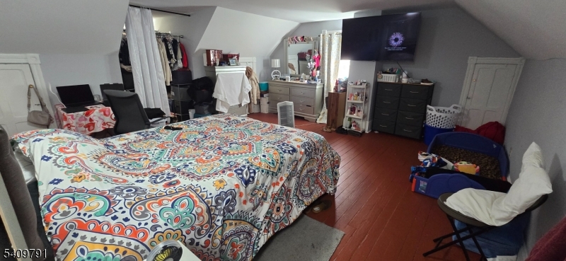 597 Belvidere Road, Unit 2 Phillipsburg, NJ 08865 - Photo 14 of 15 a bedroom with bed and a couch