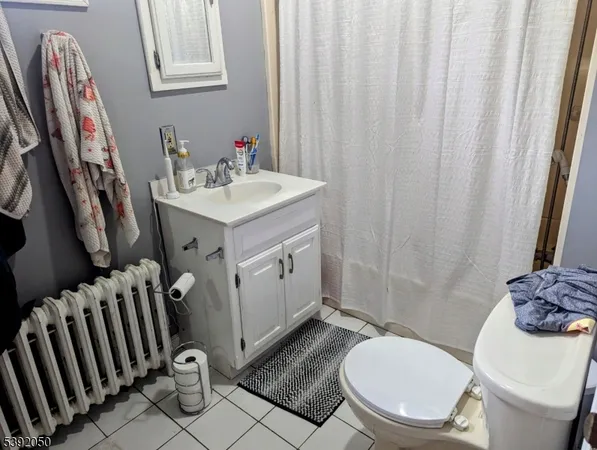 a view of a kitchen with fridge and sink
