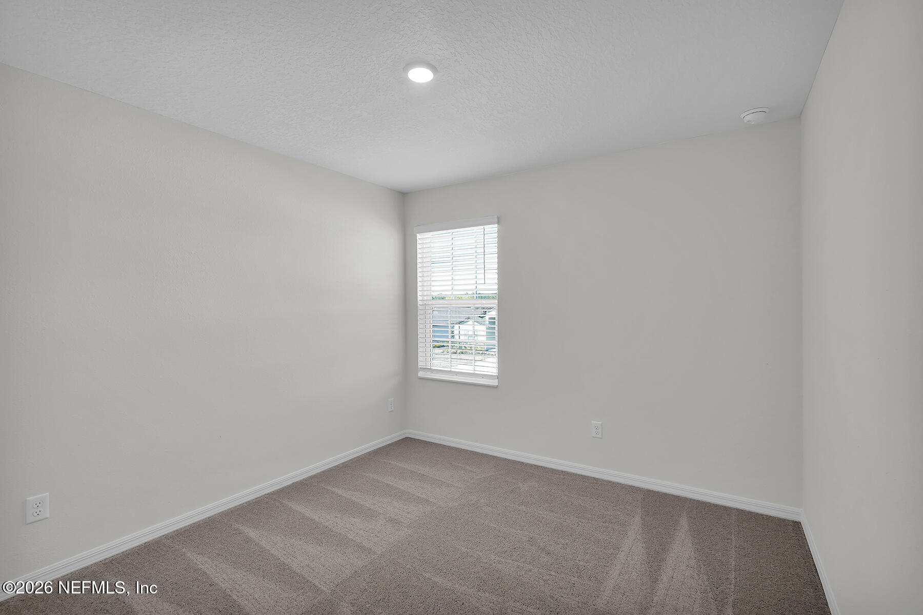 6976 Canoe Birch Road Jacksonville, FL 32219 - Photo 20 of 24 a view of an empty room and window