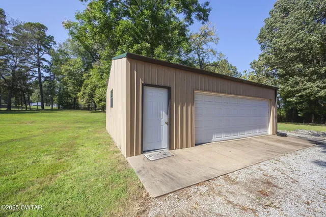 a view of a backyard of the house