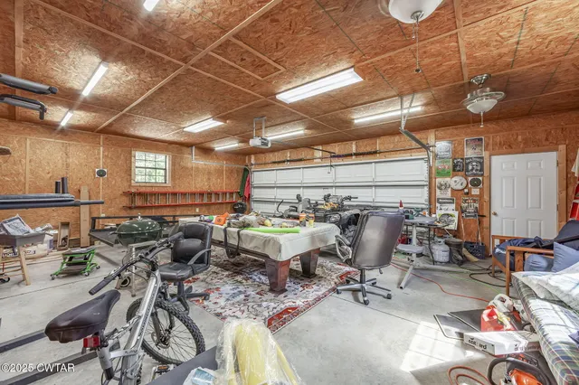 a room with lots of chairs and chandelier