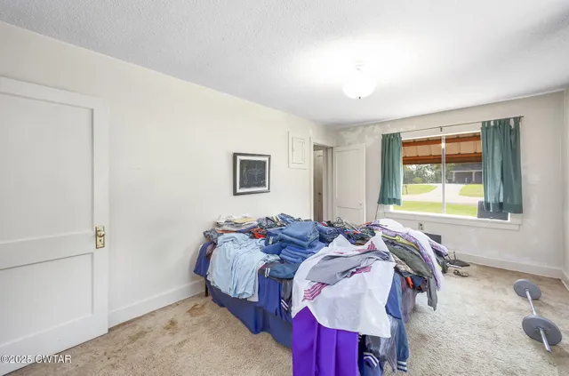 a bedroom with a bed and closet