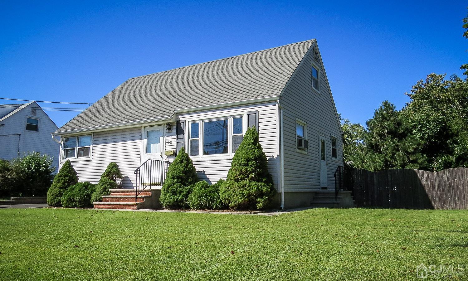 28 Longfield Road New Brunswick, NJ 08901 - Photo 1 of 14 a front view of a house with a yard