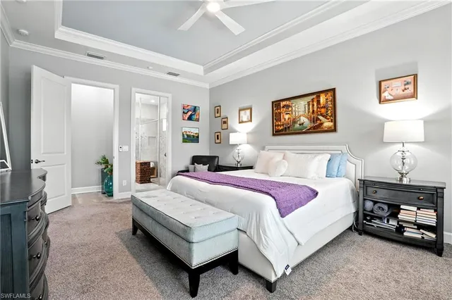 a bedroom with a bed a couch and a window